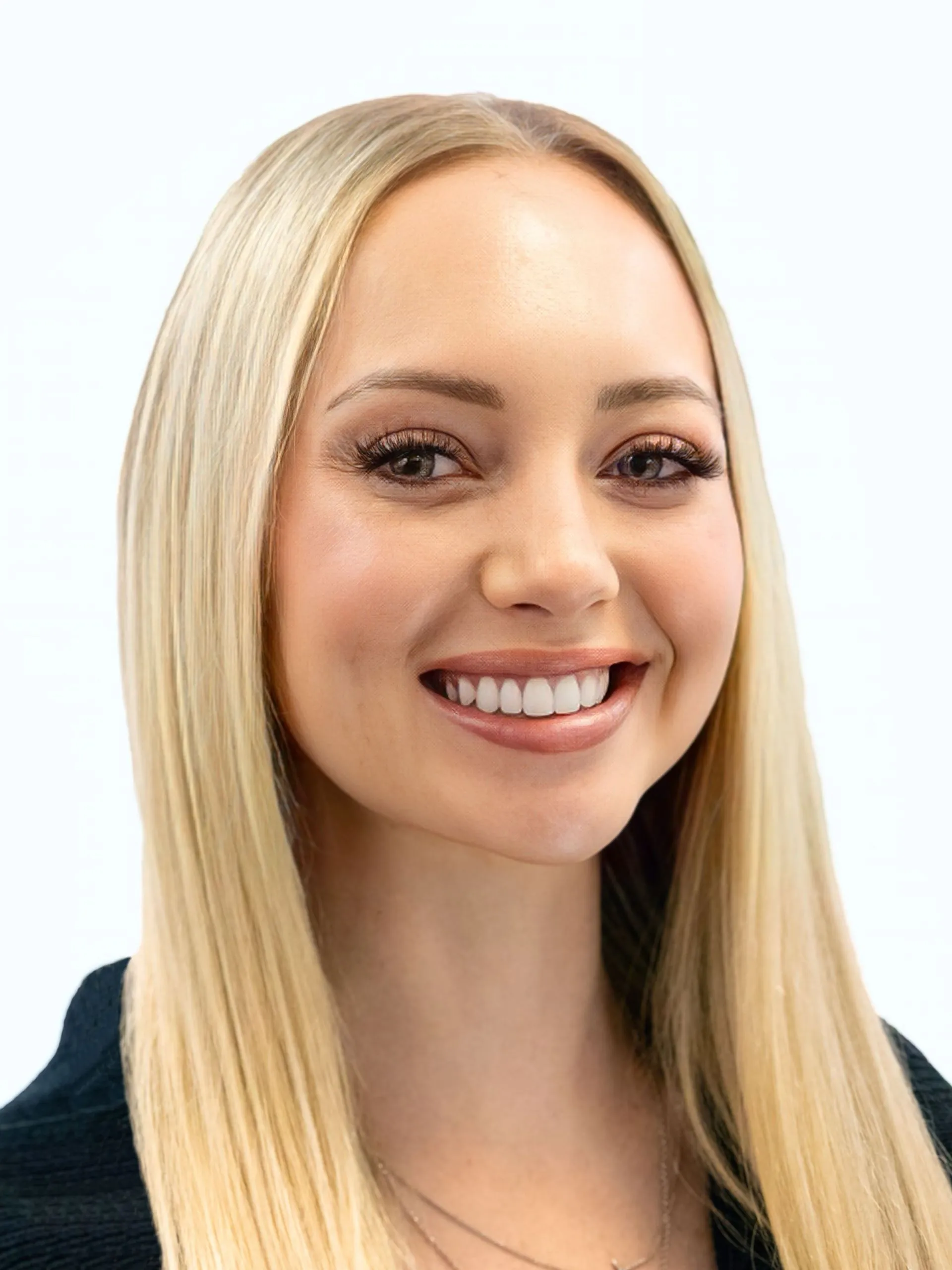 Professional headshot of a smiling woman with long blonde hair and neutral makeup.